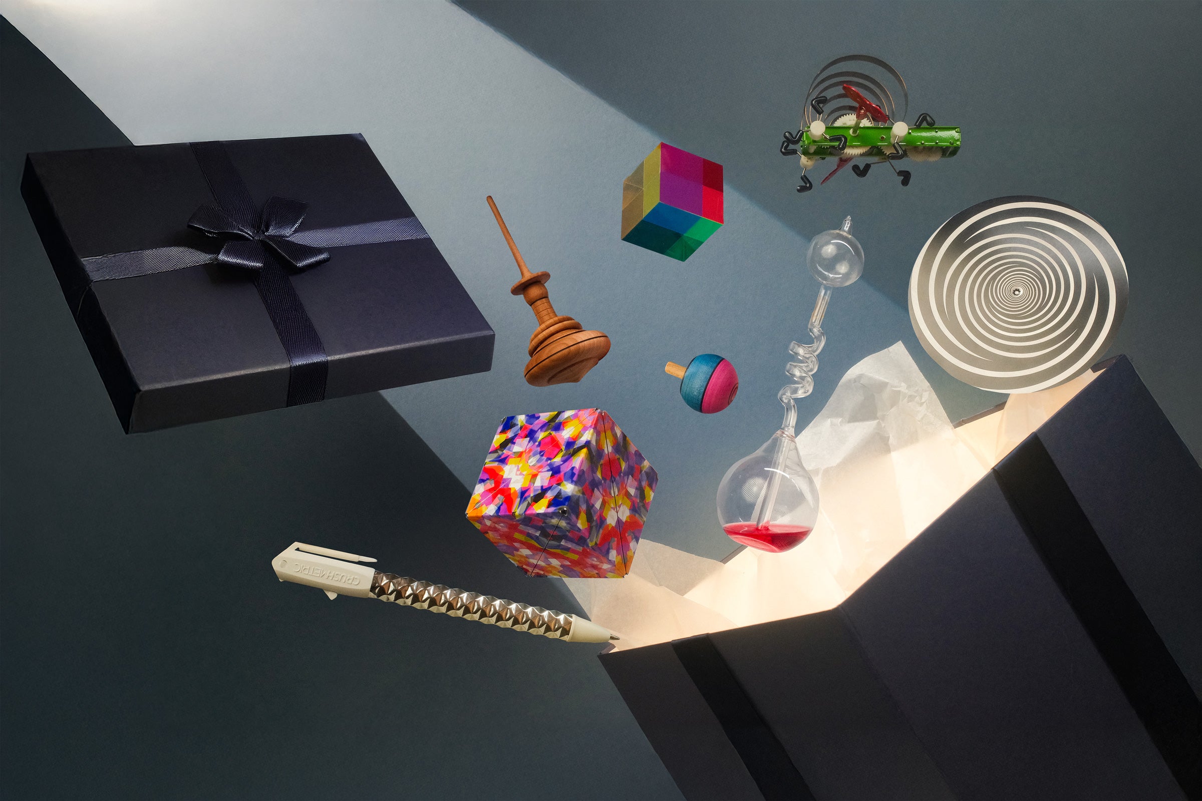 A luxurious gift box with toys rising out of it as if by magic